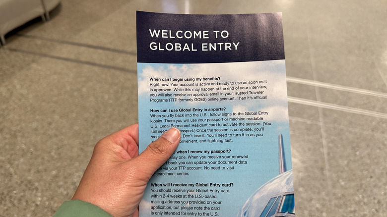 Hand holding Welcome to Global Entry flier
