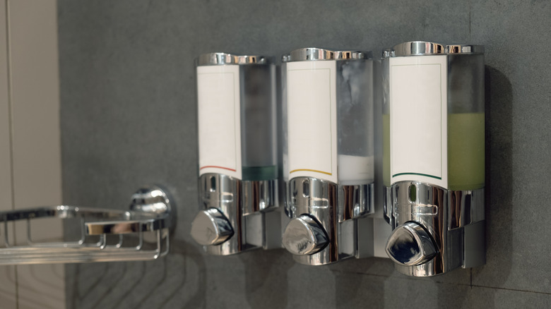 Shampoo, conditioner, and body wash dispensers in a shower