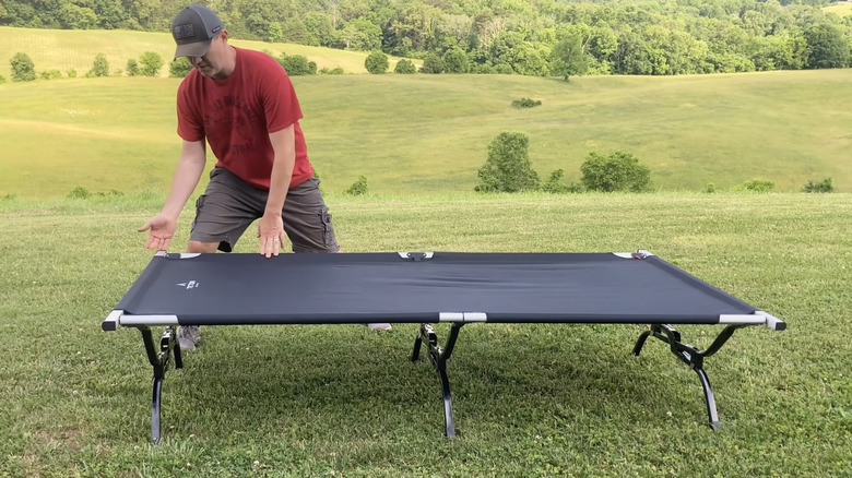 Man demonstrating the Teton camping cot on a Youtube video