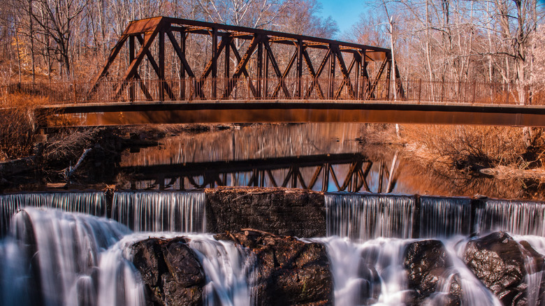 Yantic Falls in Norwich, Connecticut, with an old bridge and a forest