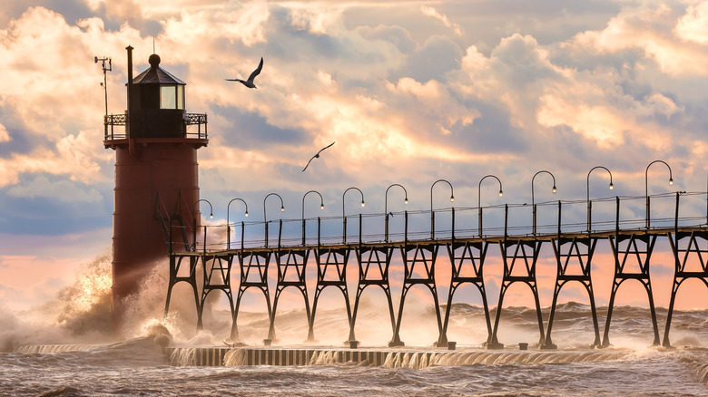The South Haven, Michigan, pier with crashing waves, seagulls, and dramatic clouds