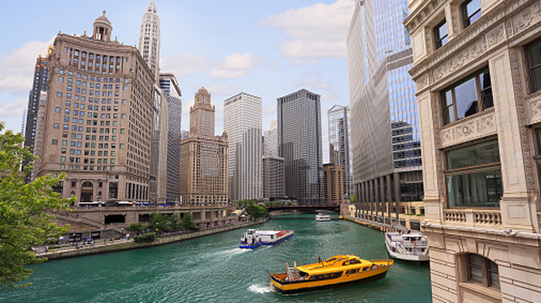 A water taxi on the Chicago River, flanked by the city's stunning architecture