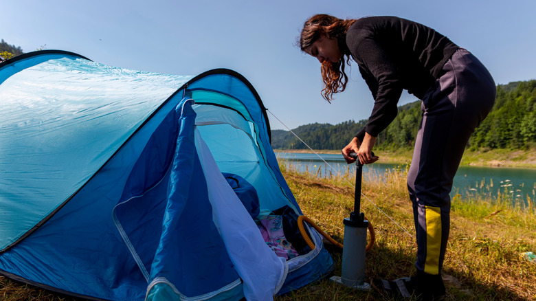 Girl pumping up air mattress