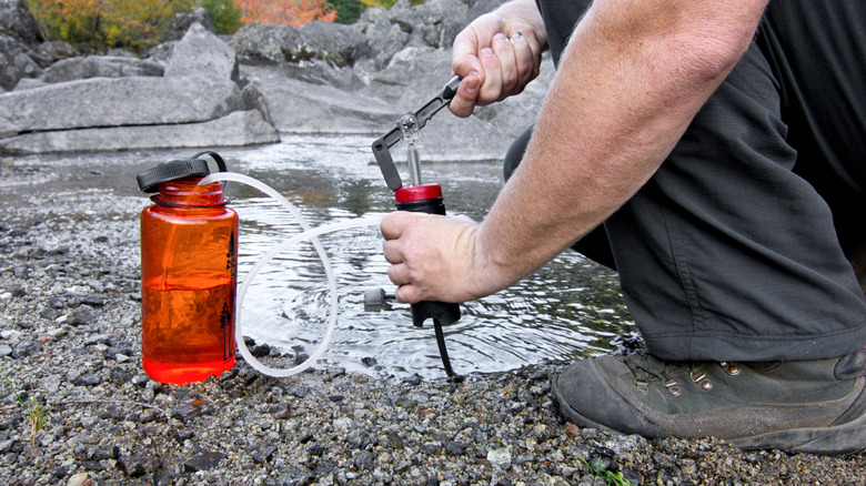 Man using water filtration system