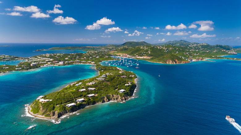 Aerial view of lush green islands of St. Thomas, turquoise waters