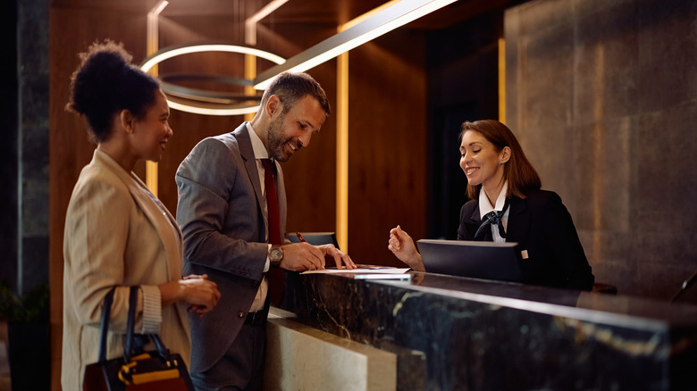 couple checking in to hotel
