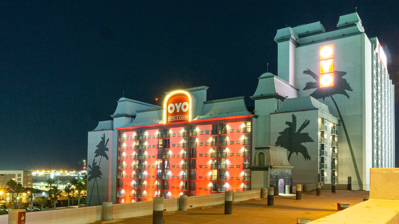 Exterior of OYO Hotel and lighted sign at night