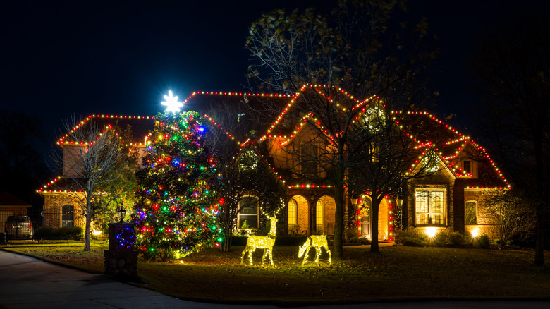 House lit up with colorful Christmas lights and displays