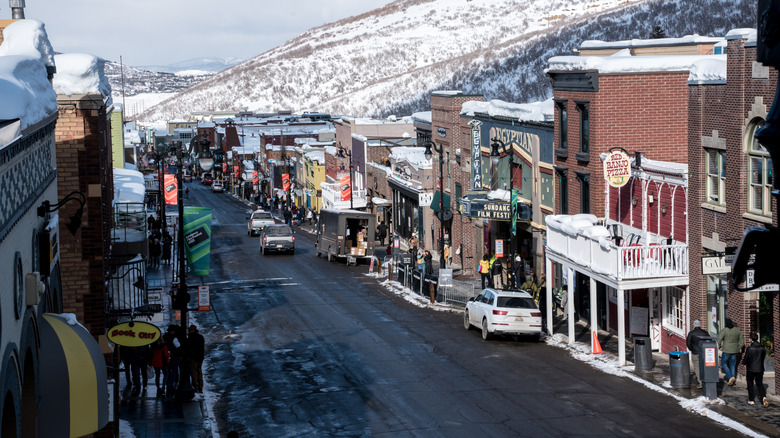 The main street in Park City with the Egyptian Theatre during winter all covered in snow.