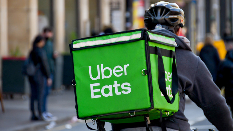 Uber Eats worker delivers food on bike