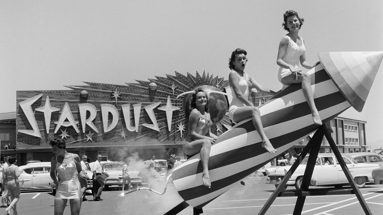 Three women on a fake rocket outside Stardust Hotel Las Vegas