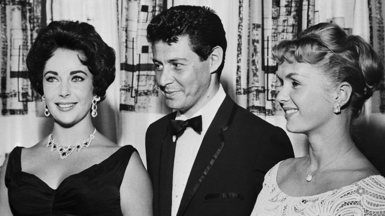 Elizabeth Taylor, Eddie Fisher, and Debbie Reynolds smile in the Tropicana