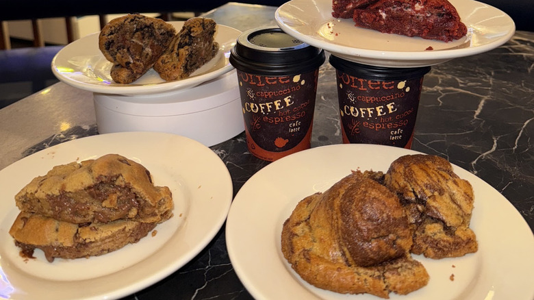 A selection of cookie flavors from Fit for a Cookie, plated and with a side of coffee