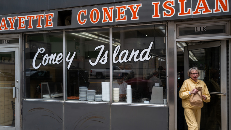 Person walks out of Coney Island luncheonette in downtown Detroit, Michigan