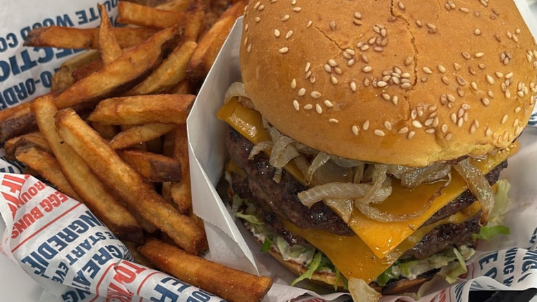 A Becks Prime cheeseburger with hand-cut fries in a signature basket