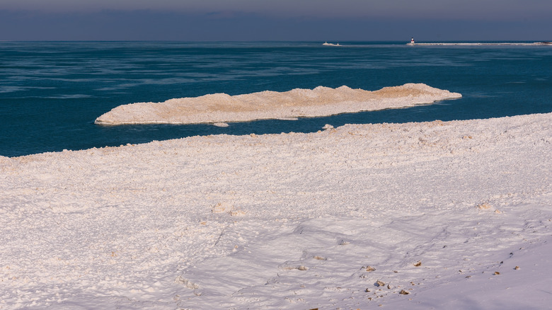 A snow covered beach in Indiana Dunes State Park during winter
