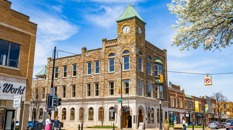 Sunny downtown Holland, Michigan with a three-story brick building from the 1800s