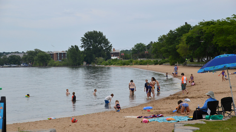People enjoying a beach in Traverse City, Michigan