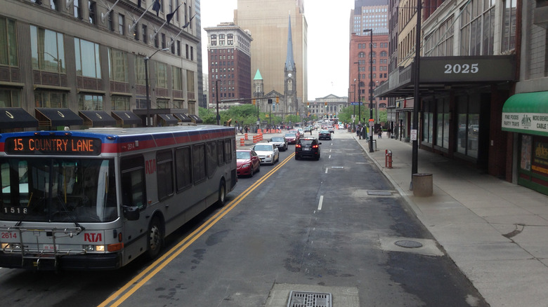 A bus drives down a busy street in Clevelnd