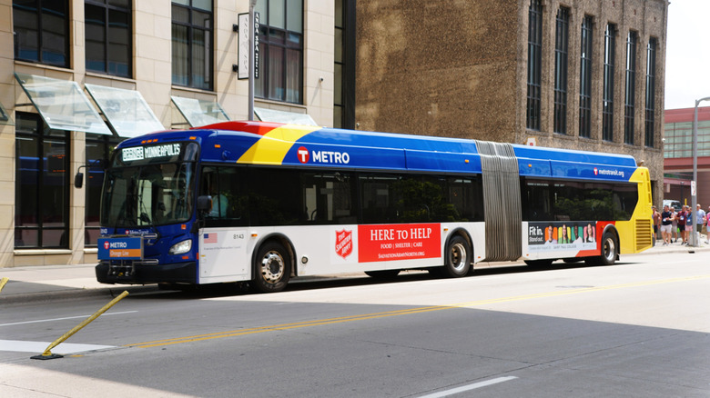 A bus drives down the street in Minneapolis