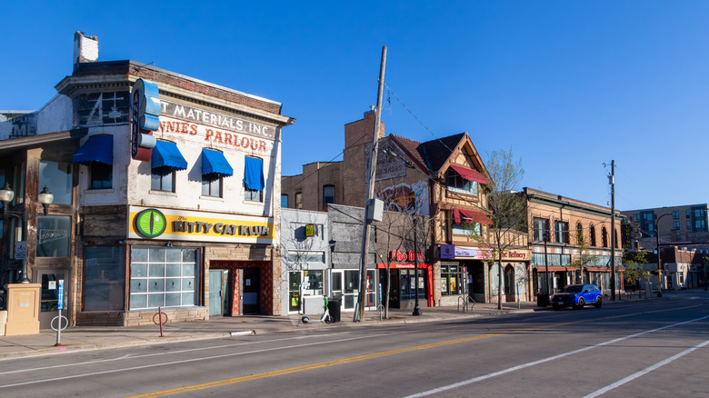 Eclectic shops and cafes along a street in Dinkytown, Minneapolis on a blue-sky day