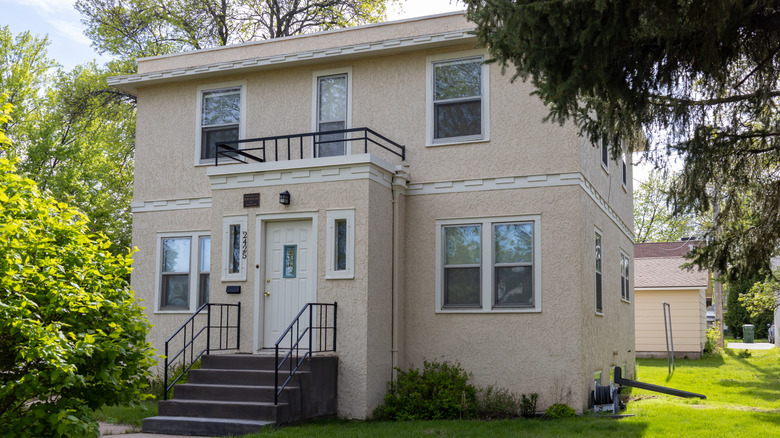 Bob Dylan's childhood home in Hibbing, Minnesota, with front yard, steps and flat-roof style