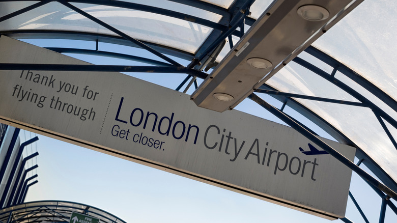Welcome sign on the Terminal Building at London City Airport, which introduced a drop-off fee