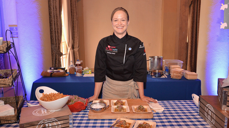 Chef Lindsay Autry stands behind a cutting board