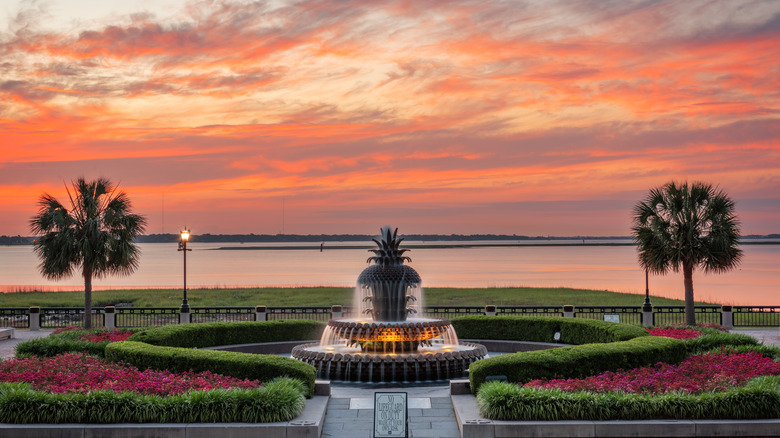 Pineapple fountain in the park at sunset