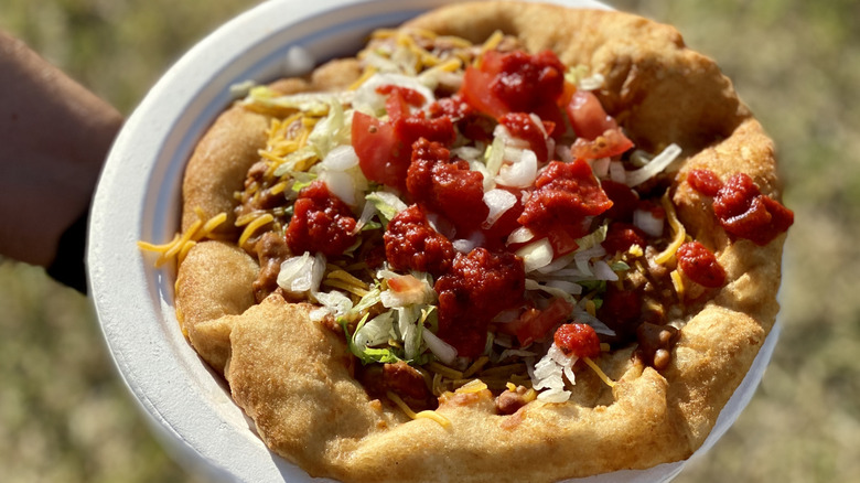 A close-up of Navajo fry bread with savory toppings, Arizona