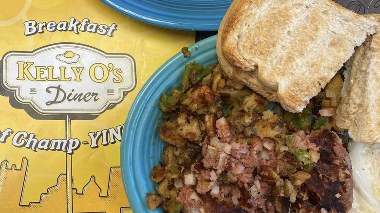 Plate of food next to Kelly O's menu