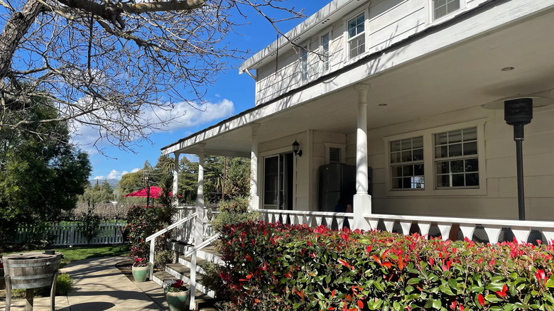 White Tolenas Winery building with plants