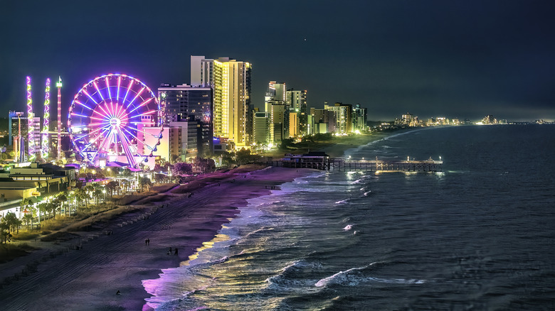 Nighttime shot of Myrtle Beach boardwalk view with Ferris wheel and ocean