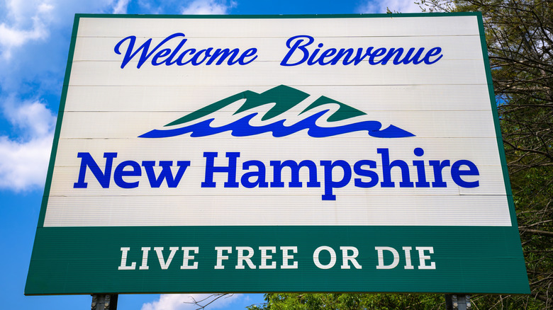 Road sign welcomes visitors to New Hampshire