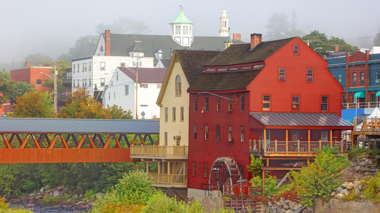 Watermill and bridge across river in vibrant town of Littleton, New Hampshire