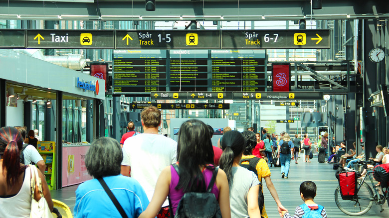 Passengers walking along Malmo's central train station