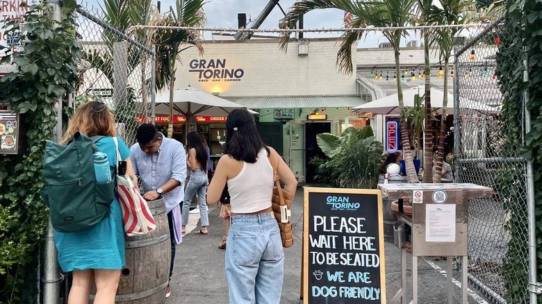 People waiting to be seated outside of Gran Torino in Brooklyn, New York