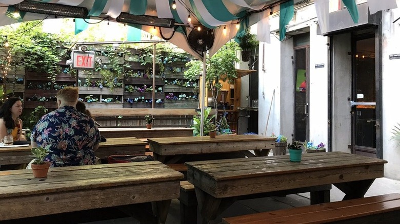 Communal tables on the patio at Loreley Beer Garden in NYC