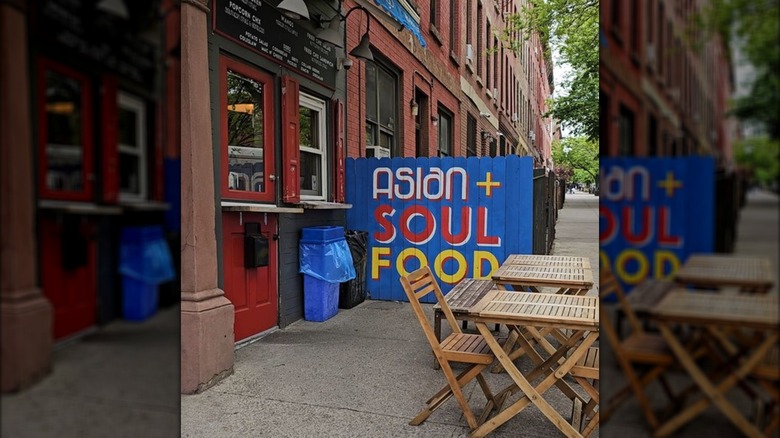 Tables outside of Wangs with blue sign in Brooklyn, NYC
