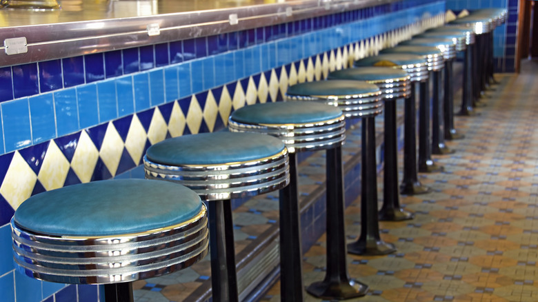 Chrome and leather bar stools in a retro diner