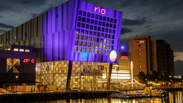 A night view shows lit-up buildings along the Rio Lakefront in Gaithersburg, Maryland