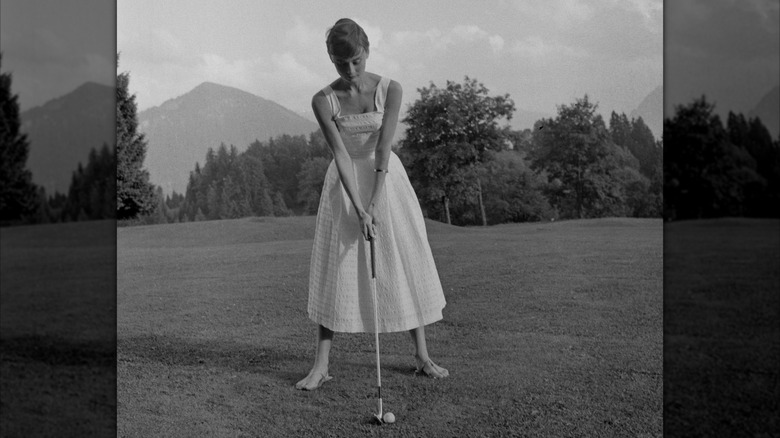 Audrey Hepburn playing golf at the Bürgenstock Resort in Switzerland
