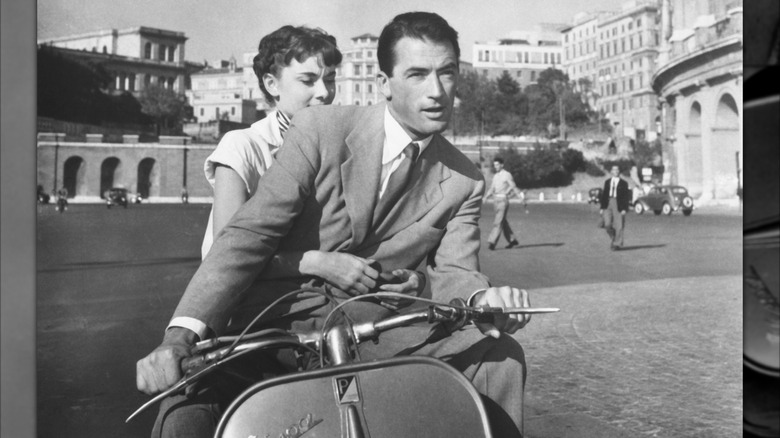 Audrey Hepburn riding on a scooter in Rome