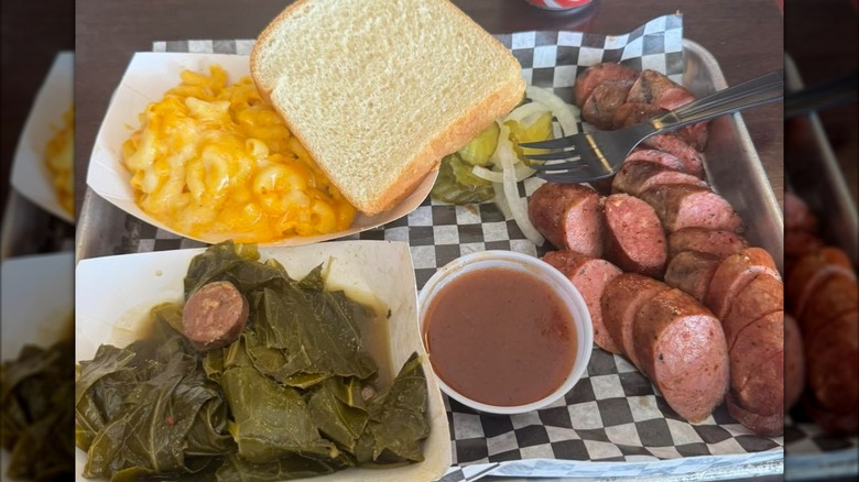 A plate of smoked sausage and sides at Lonestar Sausage and BBQ in Houston