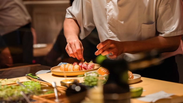 Sushi chef preparing omakase dishes