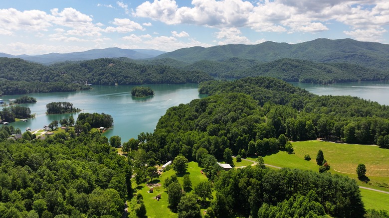 Watauga Lake surrounded by forest and mountains