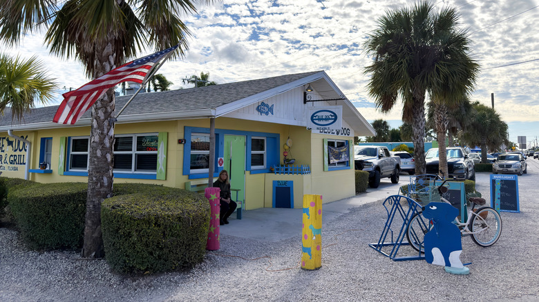 A yellow building with palm trees in Matlacha, Florida
