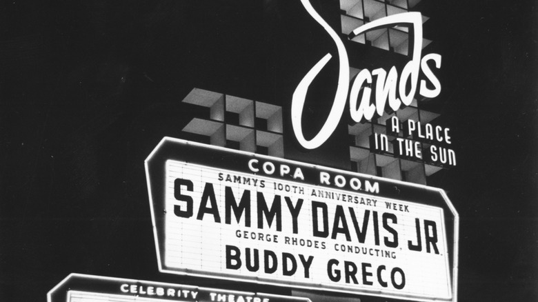 Black and white photo of the Sands hotel marquee