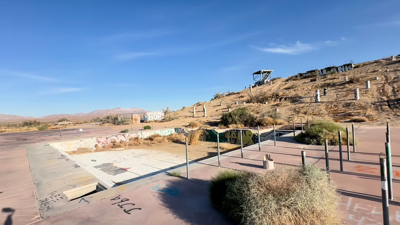 Abandoned pool and beginning of park feature in background of Lake Dolores waterpark