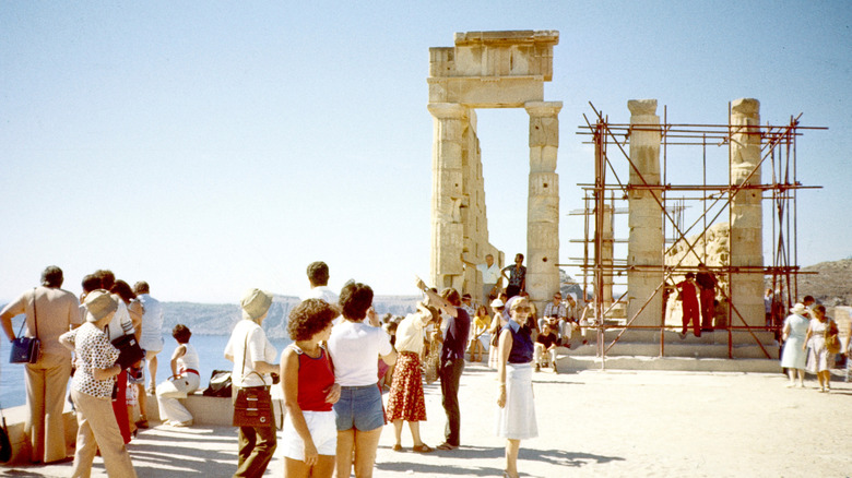 Tourist form a line at a temple in Athens in 1982